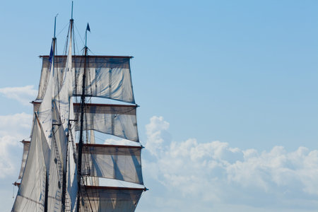 Marine or nautical background of a three masted barquentine yacht, square rigged on the foremast,...