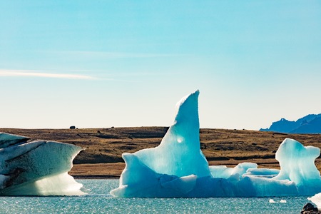 Bizarre shapes of blue icebergs calved off Vatnajokull glacier floating in Jokulsarlon glacier lagoon, Iceland, IS, Europeの写真素材