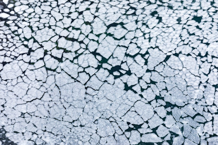 Background texture pattern abstract of pack ice broken into ice floes floating on frozen winter...