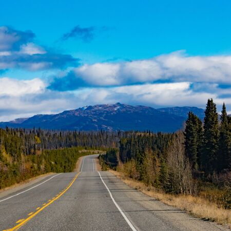 Alaska Highway Alcan in great empty nature wilderness landscape of Southern Yukon Territory, YT, Canadaの写真素材