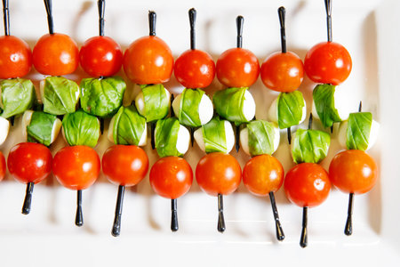 catering cherry tomatoes canape white plateの写真素材