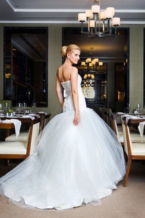 Beautiful bride in a wedding dress in the restaurantの写真素材
