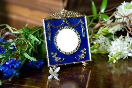 Still life with antique ornate frame.の写真素材