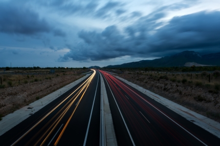 Highway with traces of car lights. Twilight.の写真素材