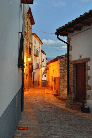 Streets of the old  town Ares in Spain   Evening time  Darkness with illumination の写真素材