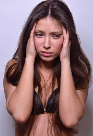 Emotional Beautiful woman  in black underwear in studio with grey background. Not object.の写真素材