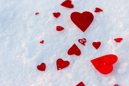 red hearts on snow backgroundの写真素材