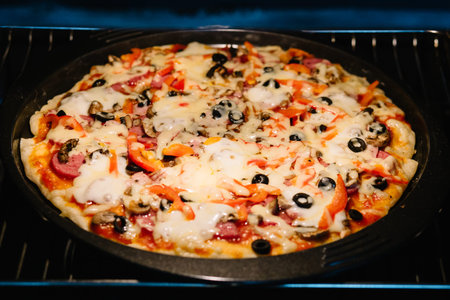 homemade pizza in the ovenの写真素材