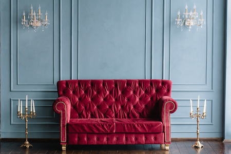 vintage quilted sofa and candlesticksの写真素材