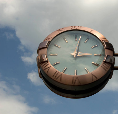 clock against the blue skyの写真素材