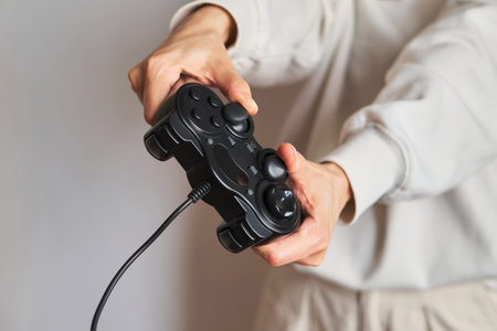 Gamepad in the hands of a girl. Gamer with joystick. Player play in computer and console games....
