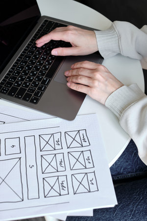 Woman designer create website design wireframe. Sketch, prototype, framework, layout future design...