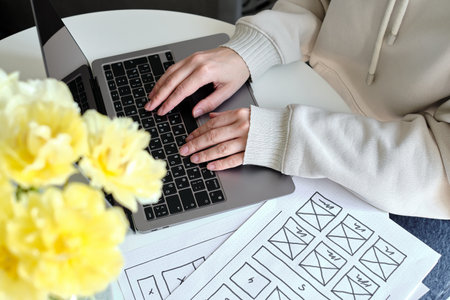 Woman designer create website design wireframe. Sketch, prototype, framework, layout future design project. UI and UX - user interface, user experience designer. Creative conceptの写真素材