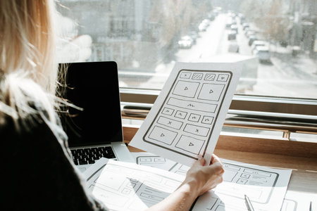 Woman designer create website design wireframe. Sketch, prototype, framework, layout future design...