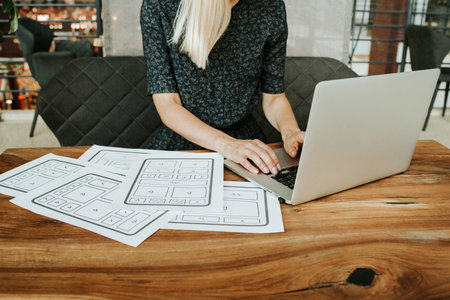 Woman designer create website design wireframe. Sketch, prototype, framework, layout future design...
