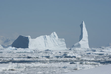 A large iceberg in the Strait clogged with ice.