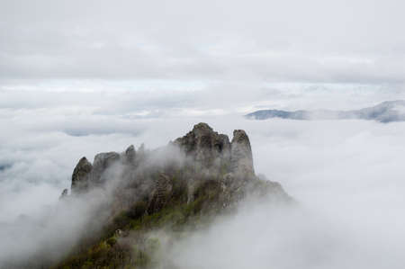 The mountain in the fog in the cloudyの写真素材