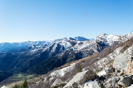 Mountains in the rays of the sun on a spring morningの写真素材
