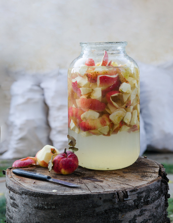 Making of apple vinegar - rustic scene from the yardの写真素材