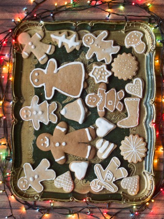 Gingerbread family on a tray with christmas decorationの写真素材