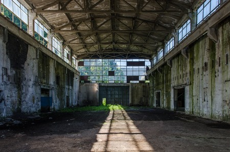 Abandoned industrial hall in the morning sunshineの写真素材