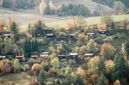 Small cabins in the mountains - autumn forest landscape from Slovakiaの写真素材