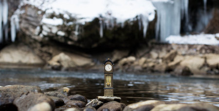 Vintage antique standing clock by the riverside