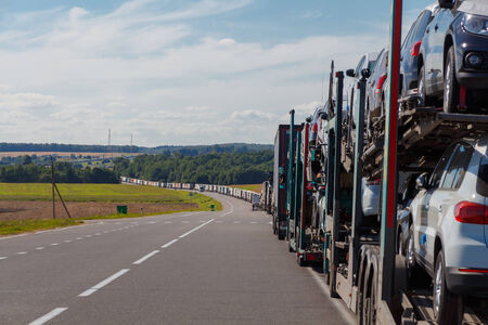 Belarus, Stone Log - July 18, 2014: Automotive queue of heavy vehicles on the road before crossing the border with the European.の写真素材