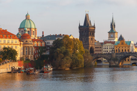 Prague, Czech Republic - October 3, 2014: View of Prague and the Vltava River Promenade. Excursions on the Vltava River on tourist ships.のeditorial素材