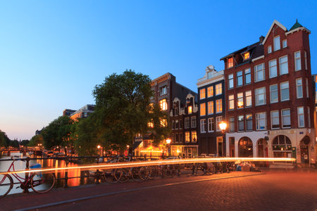 Amsterdam, Netherlands - July 30, 2014: Canals of Amsterdam. Favorite place for walking and leisure travelers.のeditorial素材