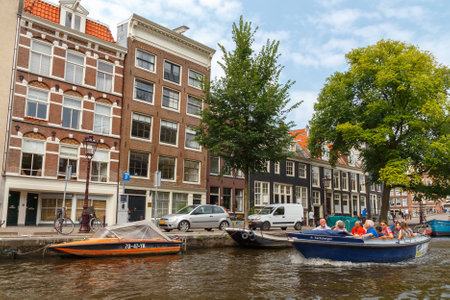 Amsterdam, Netherlands - July 29, 2014: Canals of Amsterdam. Favorite place for walking and leisure travelers.のeditorial素材
