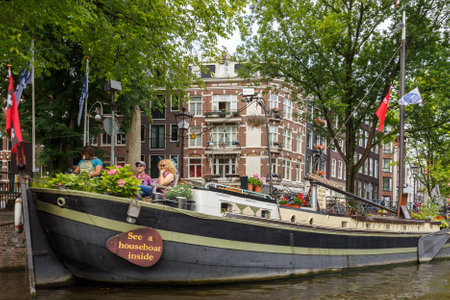 Amsterdam, Netherlands - July 29, 2014: Canals of Amsterdam. Favorite place for walking and leisure travelers.のeditorial素材