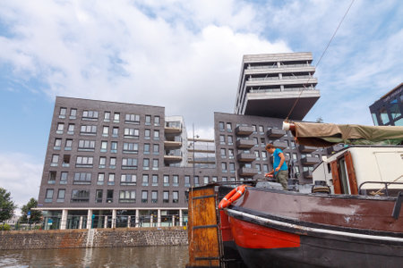 Amsterdam, Netherlands - July 29, 2014: Traditional house boat on the canals of Amsterdam. In Amsterdam, there are about 2,500 homes on the water.のeditorial素材