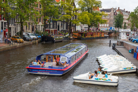 Amsterdam, Netherlands - July 29, 2014: Canals of Amsterdam. Favorite place for walking and leisure travelers.のeditorial素材