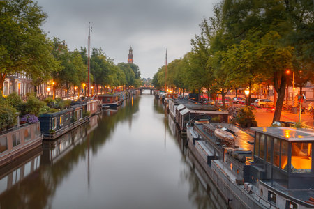 Amsterdam, Netherlands - August 6, 2014: Canals of Amsterdam. Favorite place for walking and leisure travelers.のeditorial素材