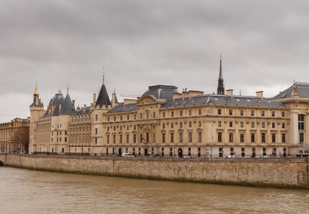 Paris, France - December 19, 2014: The building of the Conciergerie and Pont Neuf in a  gloomy winter day.のeditorial素材