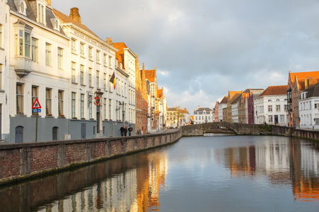 Bruges, Belgium - December 25, 2014: Excursion tour by boat on the canal Spiegel Rei of the medieval city of Bruges, Belgium.のeditorial素材