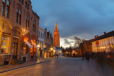 Bruges, Belgium - December 25, 2014: Quay of the Dijver. One of the most visited tourist attractions.のeditorial素材