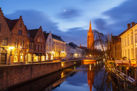 Bruges, Belgium - December 25, 2014: Quay of the Dijver. One of the most visited tourist attractions.のeditorial素材