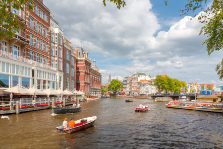 Amsterdam, Netherlands - August 3, 2014: Canals of Amsterdam. Favorite place for walking and leisure travelers.のeditorial素材