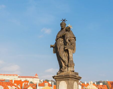 Statue of St. Anthony of Padua on Charles Bridge in Prague. Made in the 16th century.の写真素材