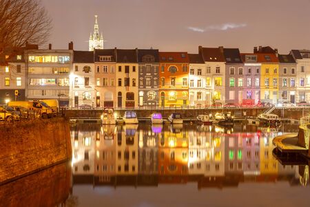 Pier boats and yachts on the river Leie in Ghent Pier boats and yachts on the river Leie in Ghent at night.の写真素材