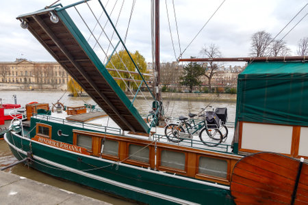 Paris, France - December 20, 2014: Vintage sailing ships along the River Seine. Favorite place for walking tourists and residents.のeditorial素材