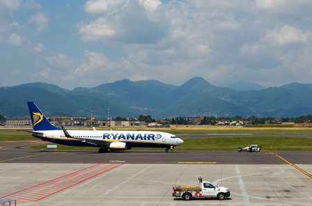 Bergamo Italy May 27 2015: Ryanair39s aircraft takes off at the airport of Bergamo. The company Ryanair offers some of the not expensive flight to Europe. Performs approximately 1600 flights a day.のeditorial素材