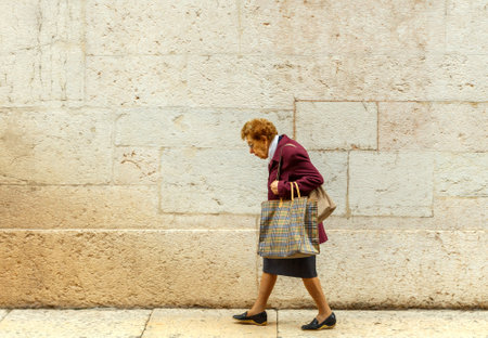Verona Italy May 26 2015: An elderly woman in the street Verona.のeditorial素材