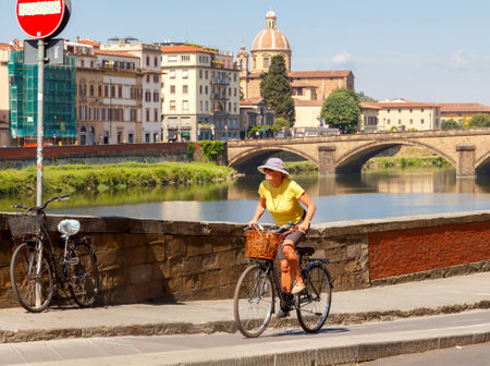 Florence, Italy - May 19, 2015: People move in Florence on bicycles. The most popular and environmentally friendly transport in Italy.のeditorial素材