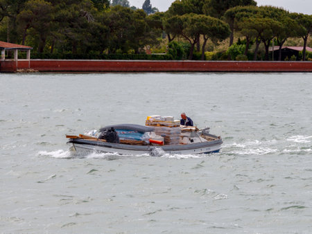 Venice, Italy - May 21 2015: Cargo Transportation Venice. All products and goods delivered to Venice carried on water transport by sea.のeditorial素材
