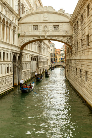 Venice, Italy - May 21, 2015: Traditional gondola ride through the channel under the bridge of sighs. A popular tourist attraction.のeditorial素材