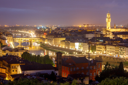 Ponte Vecchio in Florence, with water reflection at Night.の写真素材