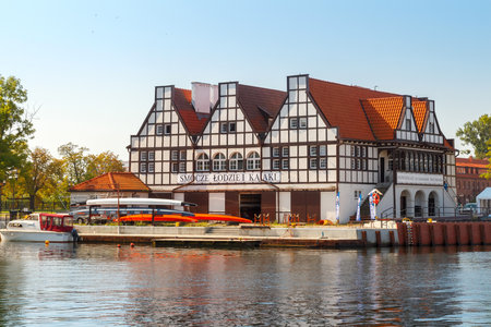 Gdansk, Poland - August 4, 2015: Rowing base with hangars for boats on the shore of the old Moltavy in Gdansk. Water sports are very popular in Poland.のeditorial素材